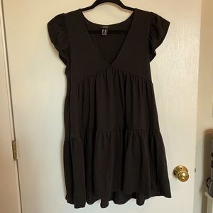Black dress with ruffled accent sleeve